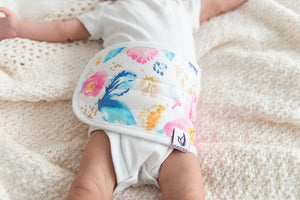 close up of baby wearing an Aquarelle baby belly band