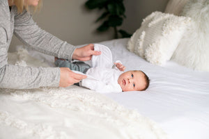 Baby wearing quill belly band for colic relief and infant gas relief