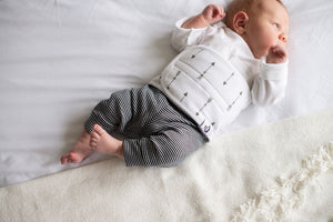 Baby wearing quill belly band for colic relief and infant gas relief