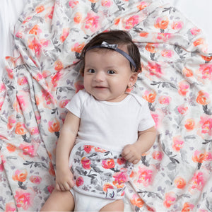 baby smiling on bed wearing Baby Belly Band - Floral - MEMEENO