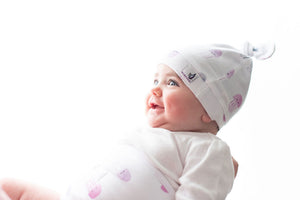 memeeno organic cotton top knot hat on baby