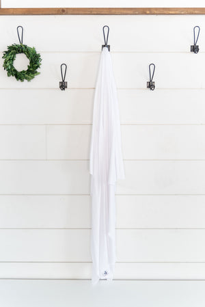pearl swaddle hanging on a hook