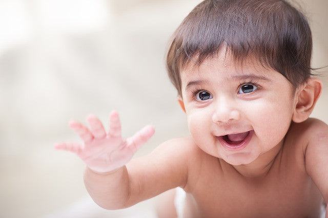 Do you smile enough around your baby? You ought to, here's why