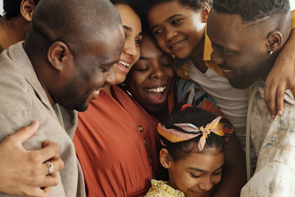 Black History Month: Black Family hugging.