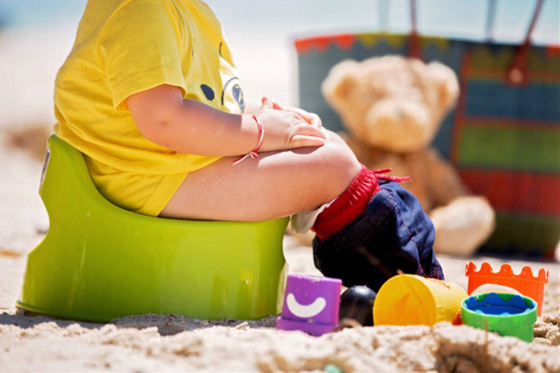 child sitting on a potty