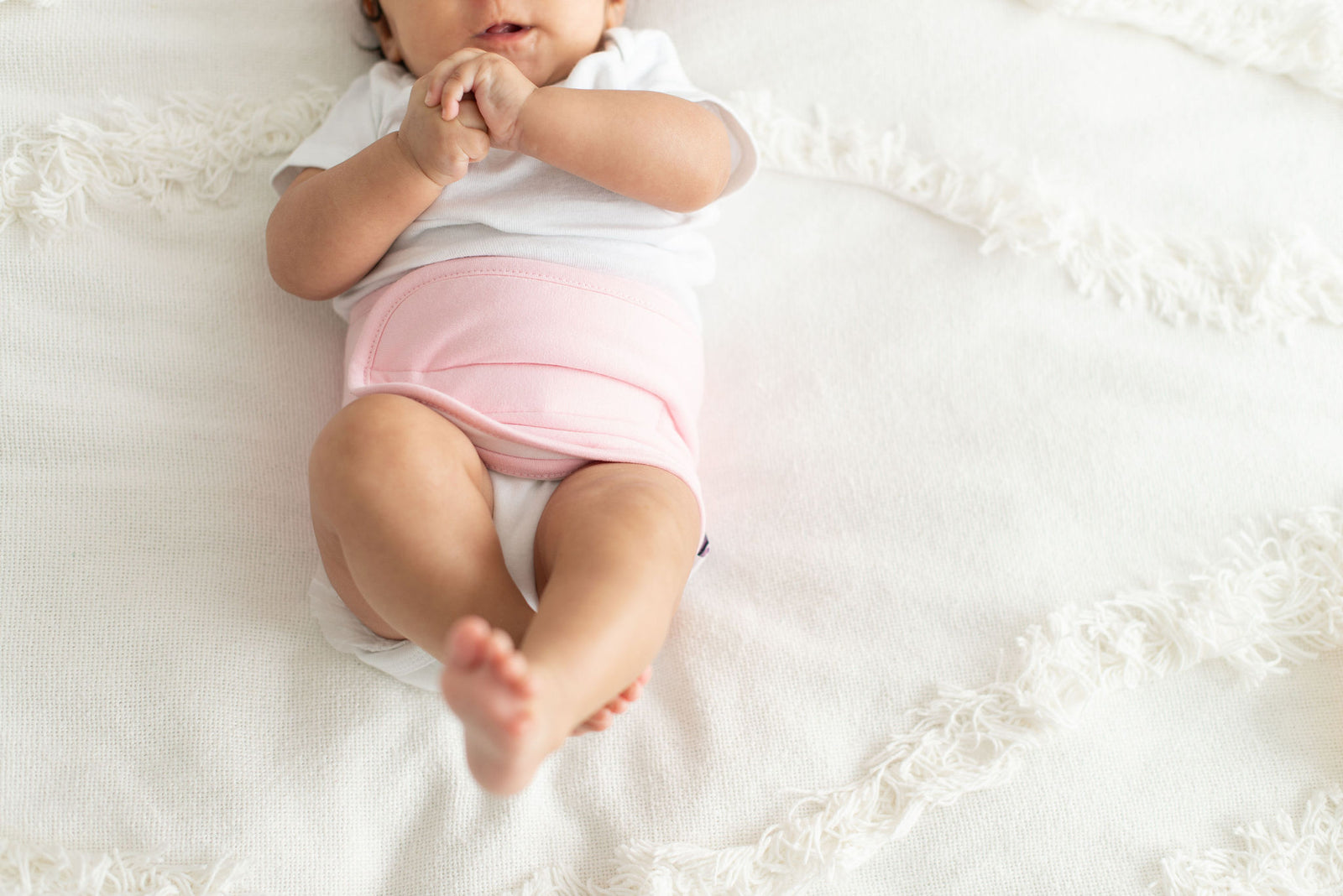 baby wearing a pink memeeno band