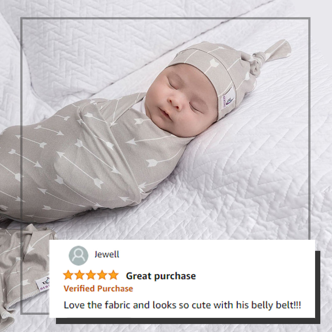 baby wearing swaddle and baby hat