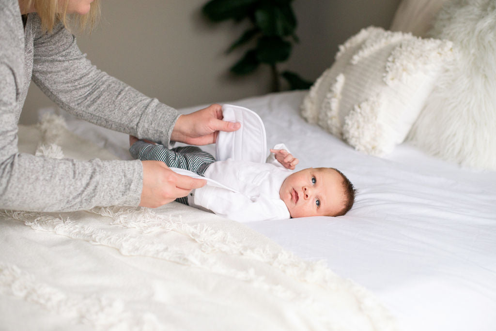 Baby wearing quill belly band for colic relief and infant gas relief