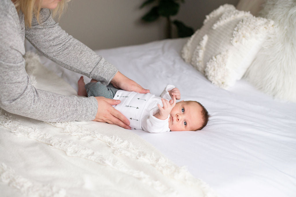 Baby wearing quill belly band for colic relief and infant gas relief